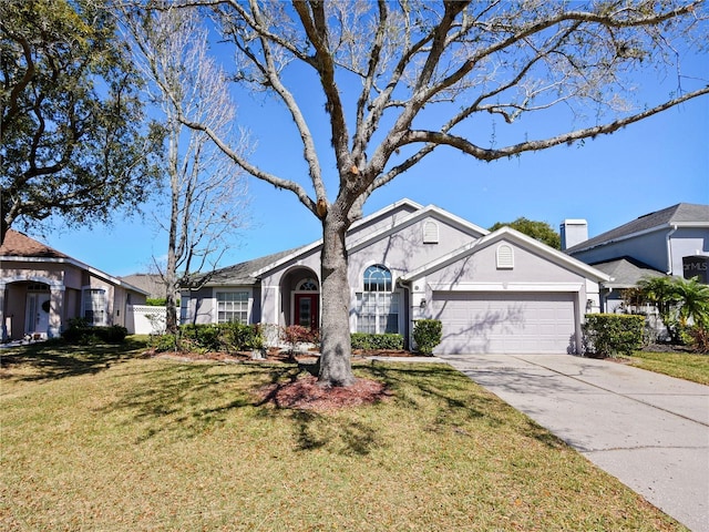 view of front facade featuring a garage, a front lawn, concrete driveway, and stucco siding