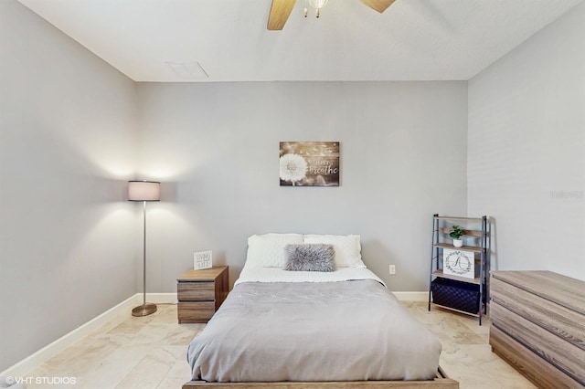 bedroom with marble finish floor, ceiling fan, and baseboards