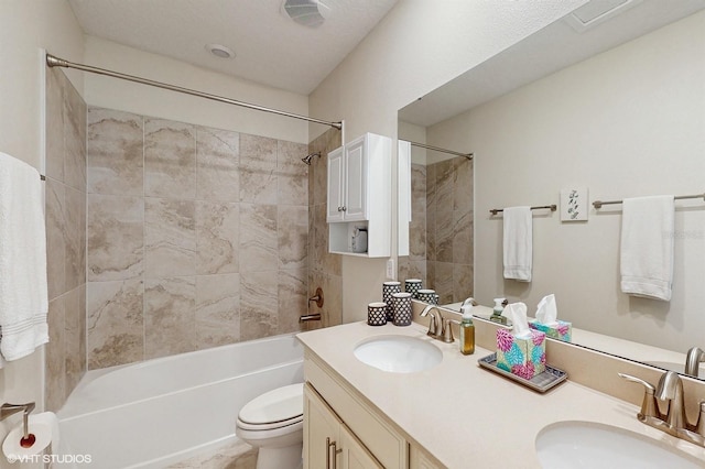 bathroom featuring toilet, shower / tub combination, double vanity, and a sink