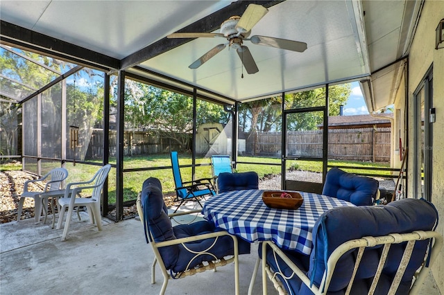 sunroom featuring ceiling fan