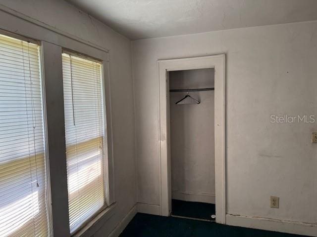 unfurnished bedroom featuring a closet