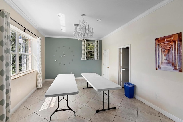 dining space featuring light tile patterned floors, baseboards, and crown molding