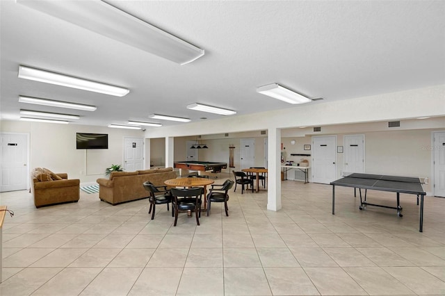 dining area featuring light tile patterned floors and visible vents