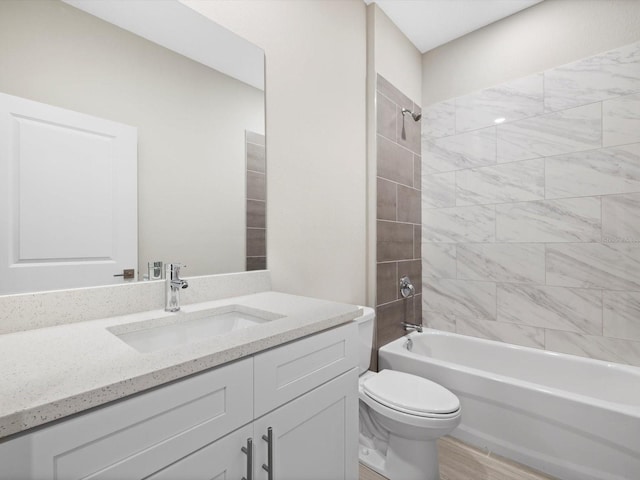 bathroom with shower / bathing tub combination, vanity, toilet, and wood finished floors