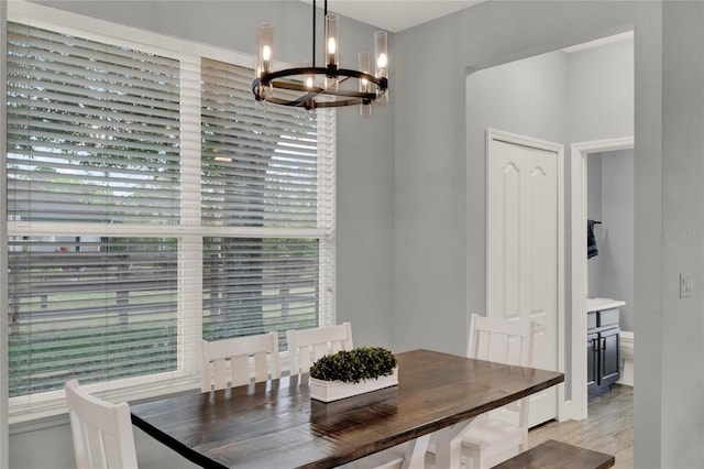 dining space with an inviting chandelier