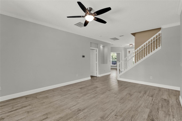 unfurnished living room featuring wood finished floors, visible vents, baseboards, stairs, and ornamental molding