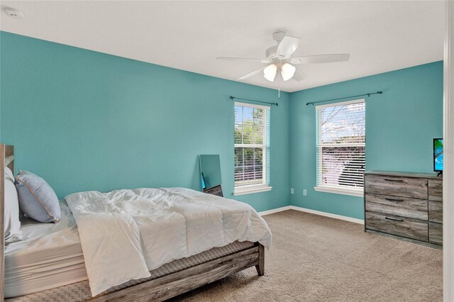 bedroom featuring carpet flooring, a ceiling fan, and baseboards