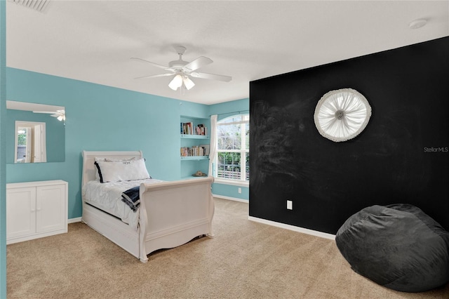 bedroom featuring carpet, visible vents, baseboards, and a ceiling fan