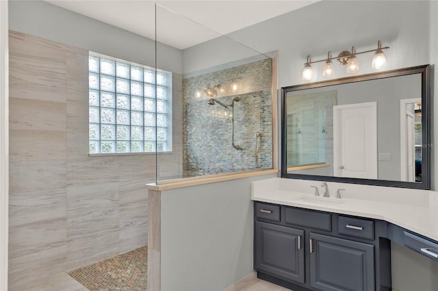 full bathroom with walk in shower and vanity