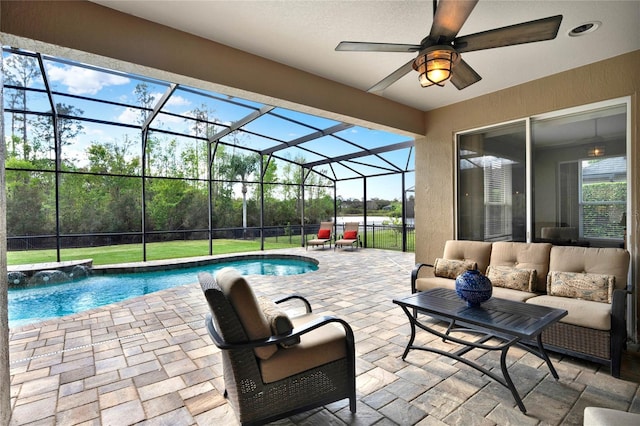 outdoor pool featuring ceiling fan, a lanai, a patio, and an outdoor hangout area