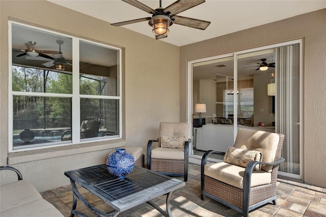 view of patio / terrace featuring ceiling fan