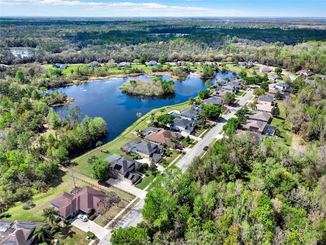 birds eye view of property with a residential view, a water view, and a forest view