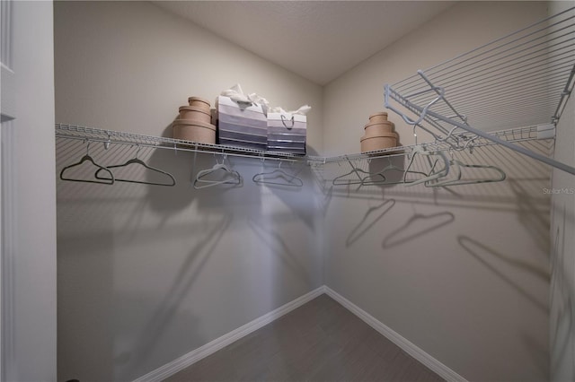 1578 Sky Lakes Dr, Saint Cloud, FL 34769 - walk in closet featuring dark wood-style floors