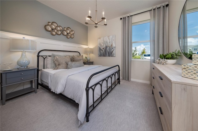 1578 Sky Lakes Dr, Saint Cloud, FL 34769 - bedroom with baseboards, vaulted ceiling, a chandelier, and light carpet