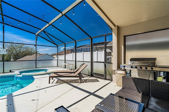 view of swimming pool with glass enclosure, fence, a pool with connected hot tub, and a patio area