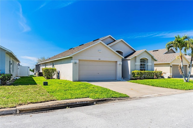 single story home featuring a front yard, a garage, driveway, and stucco siding