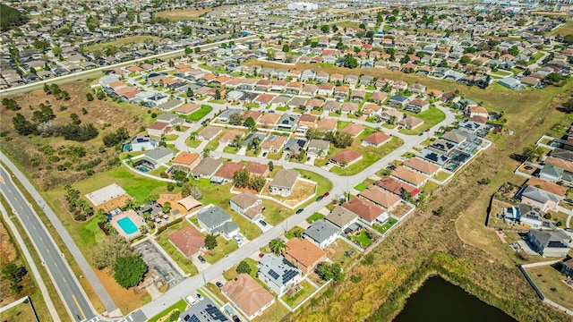 aerial view featuring a residential view and a water view