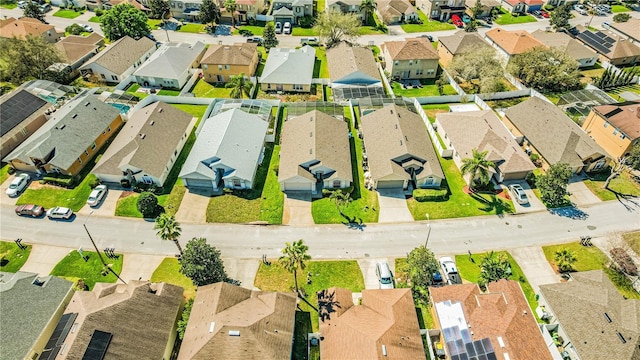 birds eye view of property with a residential view