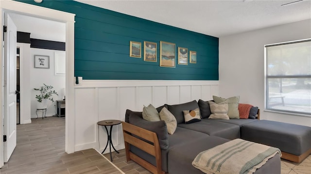 living area featuring wood tiled floor