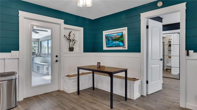 entryway with a textured ceiling and wood finished floors