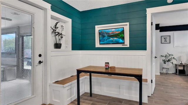 interior space with wood finish floors and a textured ceiling