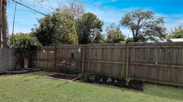 view of yard featuring a fenced backyard