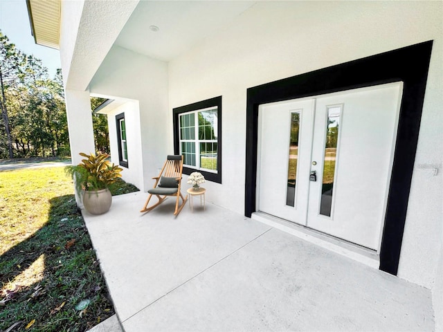 view of patio featuring french doors