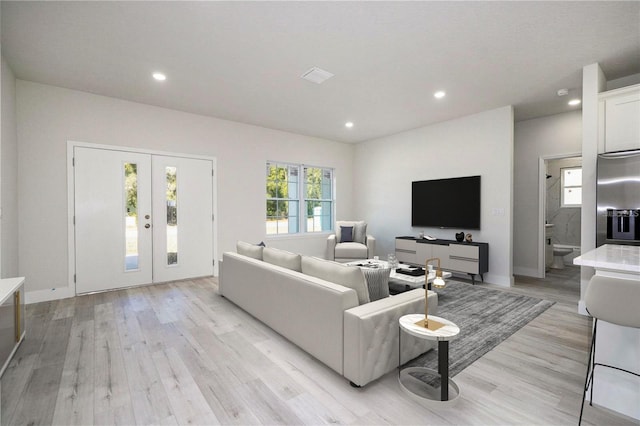 1792 W Lorraine Dr, Citrus Springs, FL 34434 - living area featuring light wood-style floors, recessed lighting, french doors, and baseboards