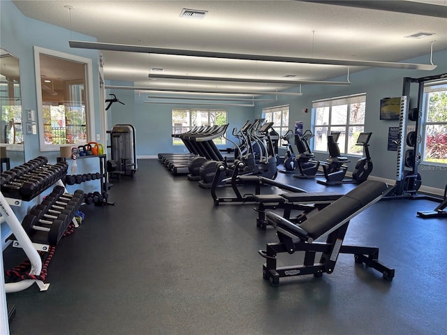 exercise room featuring visible vents and baseboards