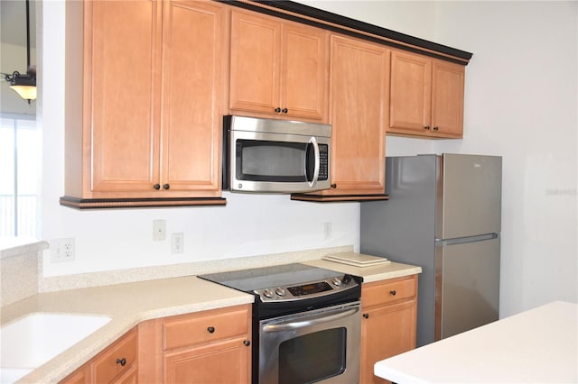 kitchen with stainless steel appliances and light countertops