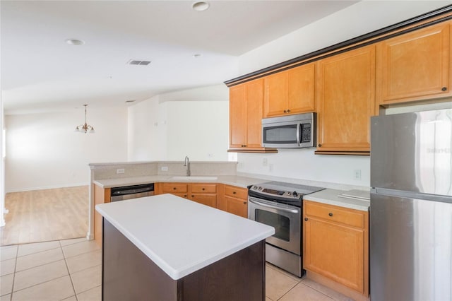 kitchen with light tile patterned flooring, a sink, visible vents, light countertops, and appliances with stainless steel finishes