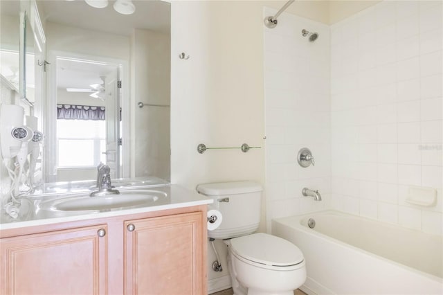 bathroom featuring shower / bathing tub combination, vanity, and toilet