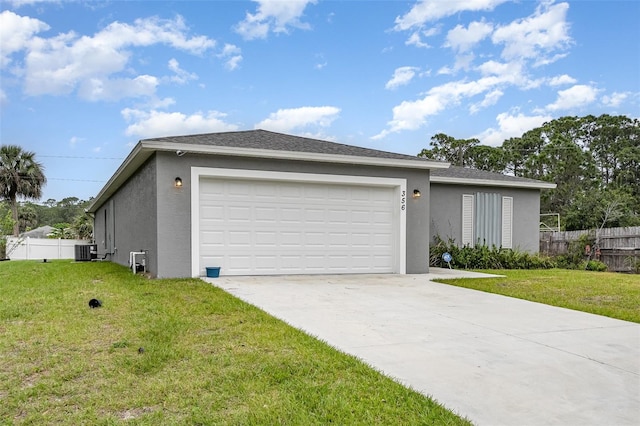 view of front of house featuring fence, driveway, and stucco siding