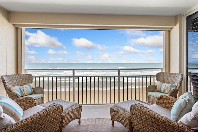 balcony with a view of the beach and a water view