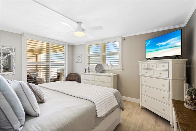 bedroom with baseboards, light wood-type flooring, a ceiling fan, and ornamental molding