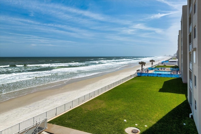 water view with a beach view and fence