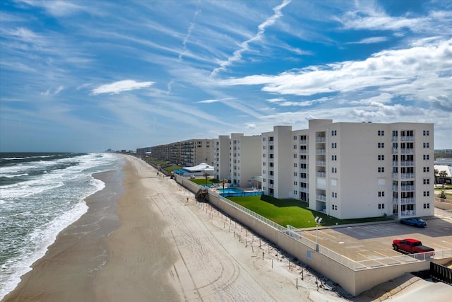 exterior space with a beach view and a water view