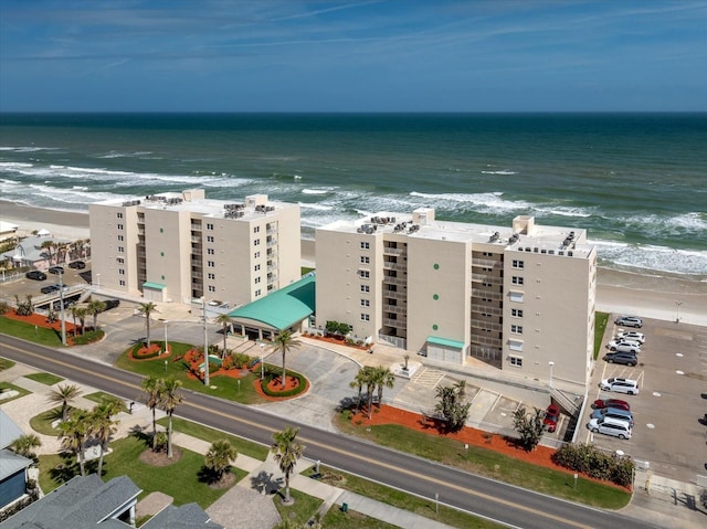 bird's eye view with a beach view and a water view