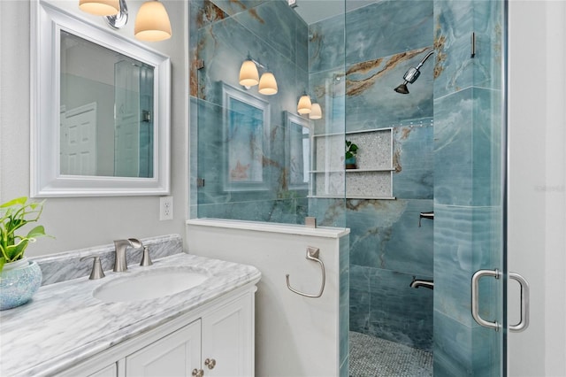 full bath featuring a shower stall and vanity