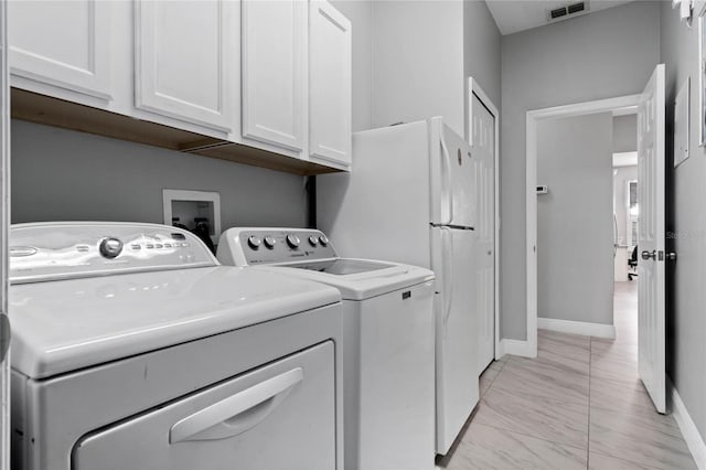 laundry room with marble finish floor, visible vents, cabinet space, separate washer and dryer, and baseboards