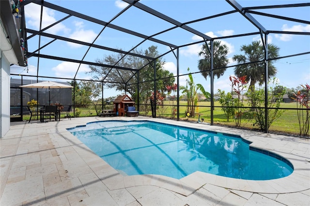 outdoor pool with a lanai and a patio