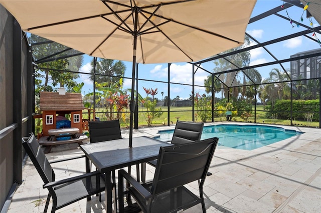 pool featuring a patio area, glass enclosure, and outdoor dining space