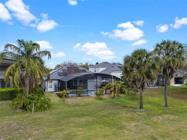 view of yard with a lanai and an outdoor pool