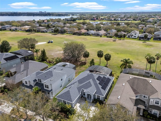 birds eye view of property with a water view and a residential view