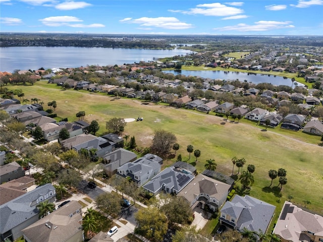 bird's eye view featuring a water view and a residential view