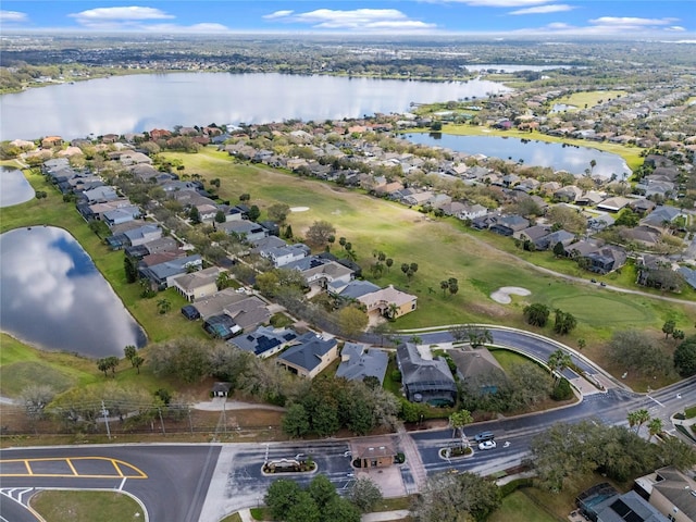 drone / aerial view with a residential view and a water view