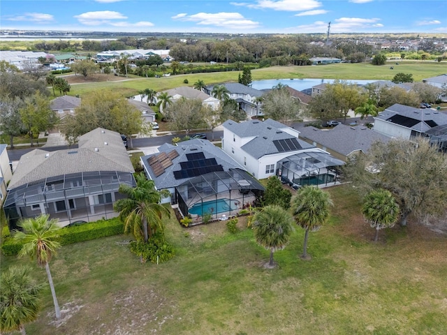 birds eye view of property with a residential view and a water view