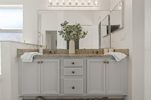 bathroom featuring double vanity