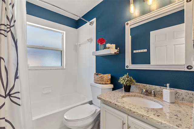 bathroom with vanity, toilet, shower / tub combo with curtain, and a textured ceiling