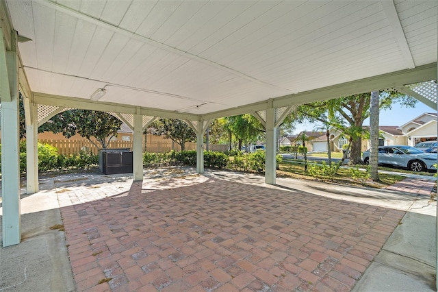 view of patio / terrace with a residential view and fence